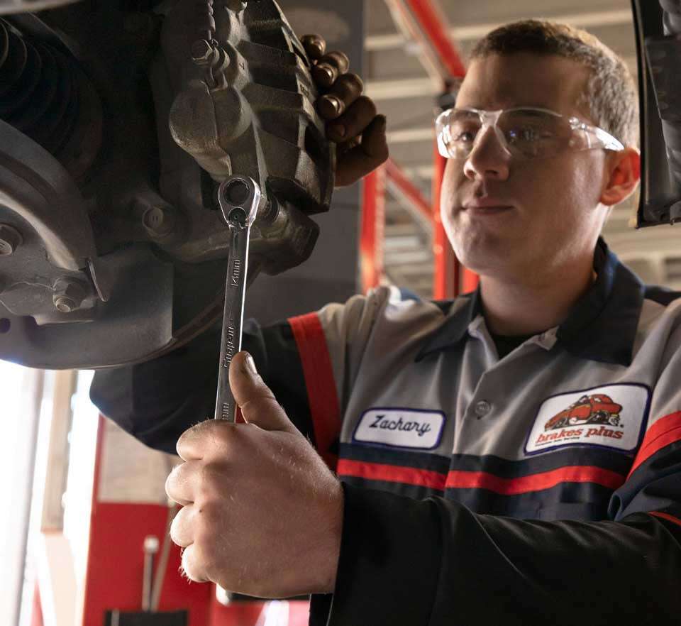 Technician working on brakes